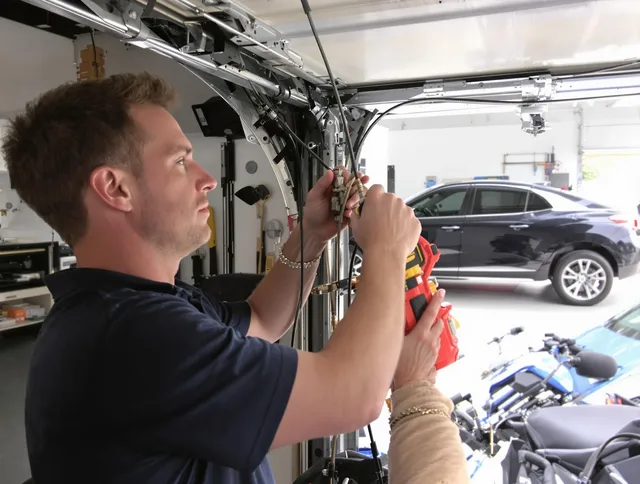 Long Beach Garage Door Repair safety certified technician performing cable replacement in Long Beach