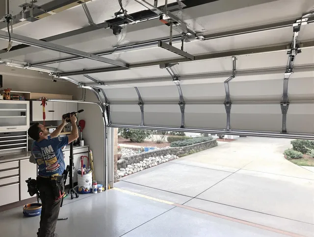 Garage door track repair service by Long Beach Garage Door Repair in Long Beach